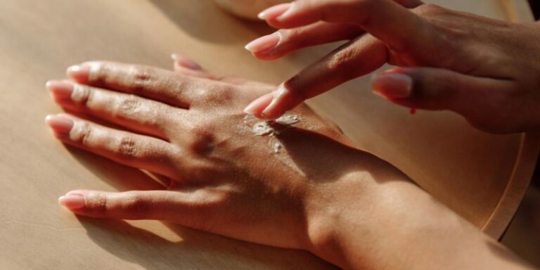 Close Up Photo of Hands with Lotion