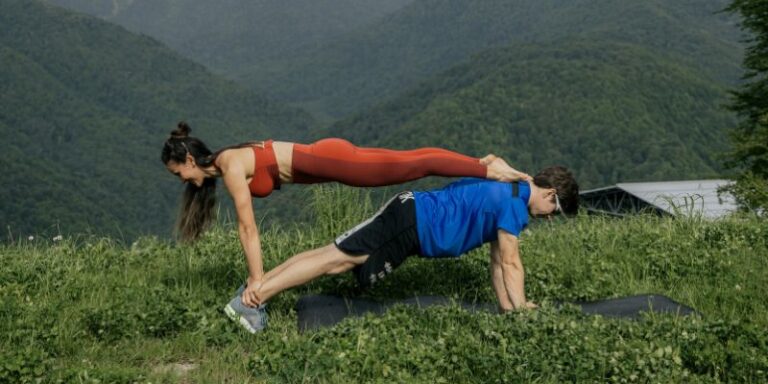 Partner yoga - A Couple Exercising Outdoors