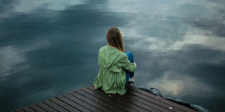 Get Your Life Together - Woman Sitting on Wooden Planks