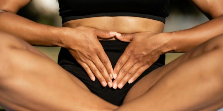 Gut Health - Sitting Woman with Hands on Stomach