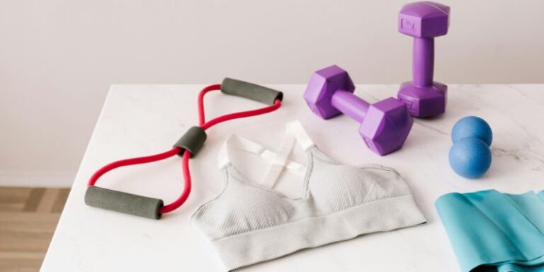 Healthy Habits - Set of sports equipment and bra for training placed on marble table
