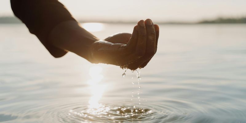 Hydration Hacks - Water Flowing on a Person's Hand