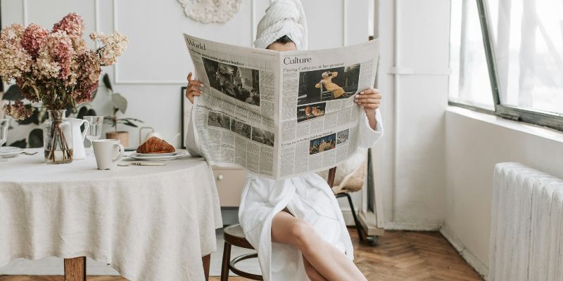 Micro Habits - Woman in White Robe Sitting on a Chair While Reading