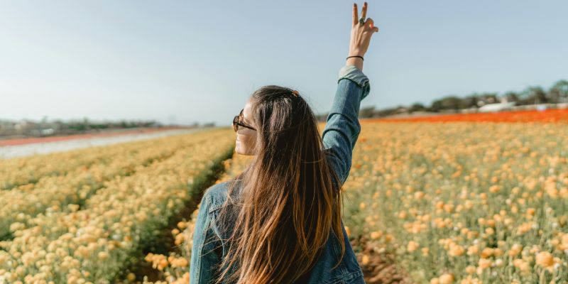 Self-Discovery - Woman Standing On Yellow Petaled Flower Garden Raising Hand