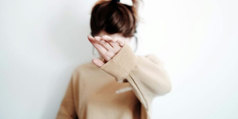 Overthinking - Photo of a Girl Hiding Her Face