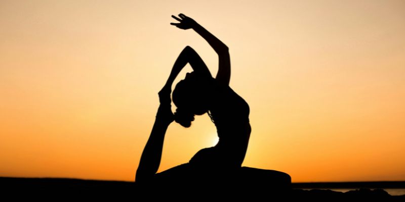 sun salutation - Silhouette of Woman Doing Yoga