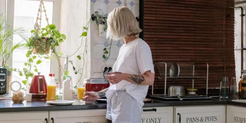 That girl - Woman in White Shirt Standing in Kitchen