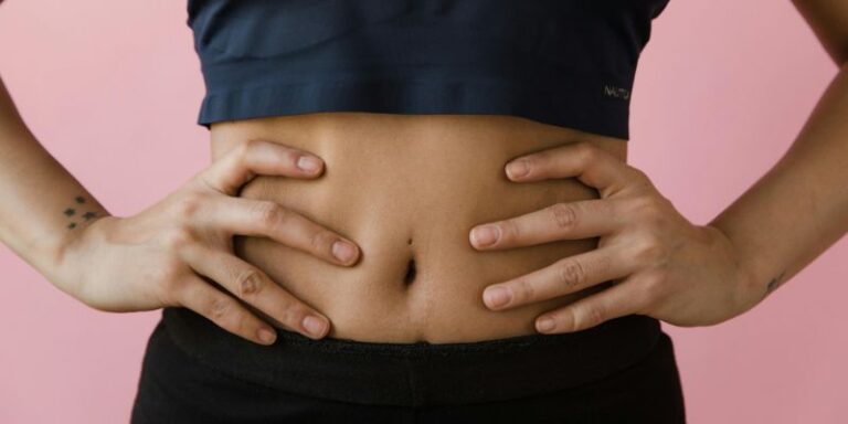Yoga For Gut Health - A Woman Hands on Her Belly