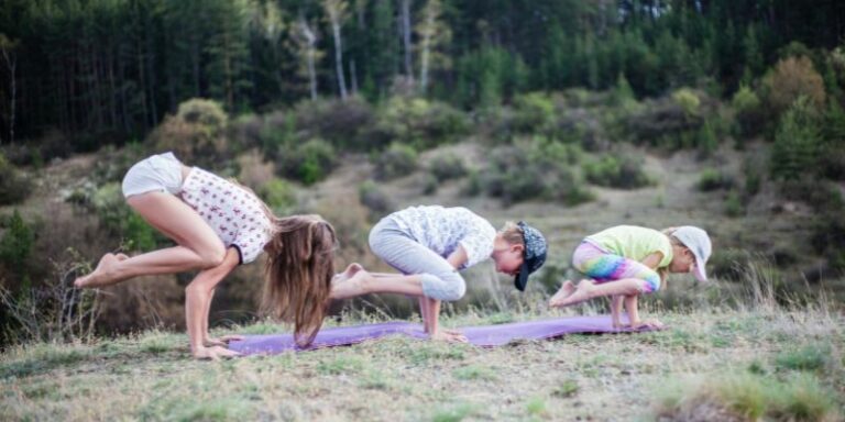 Yoga for moms - A Family Doing Yoga on a Grass Field